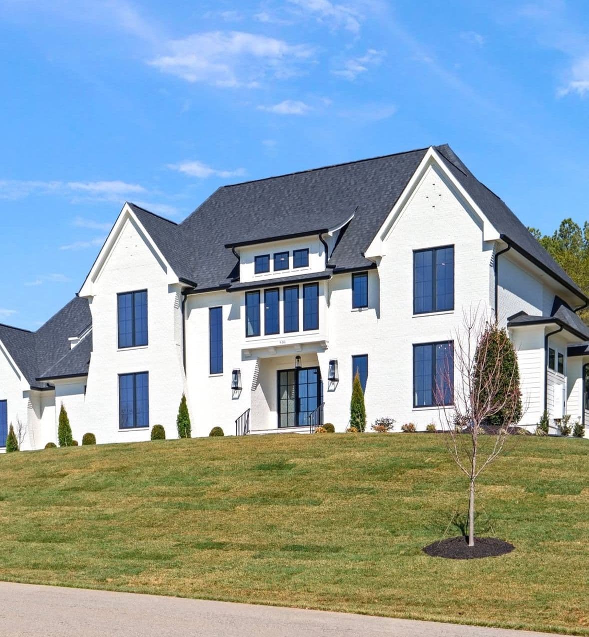 White luxury custom home exterior by BWA Builders